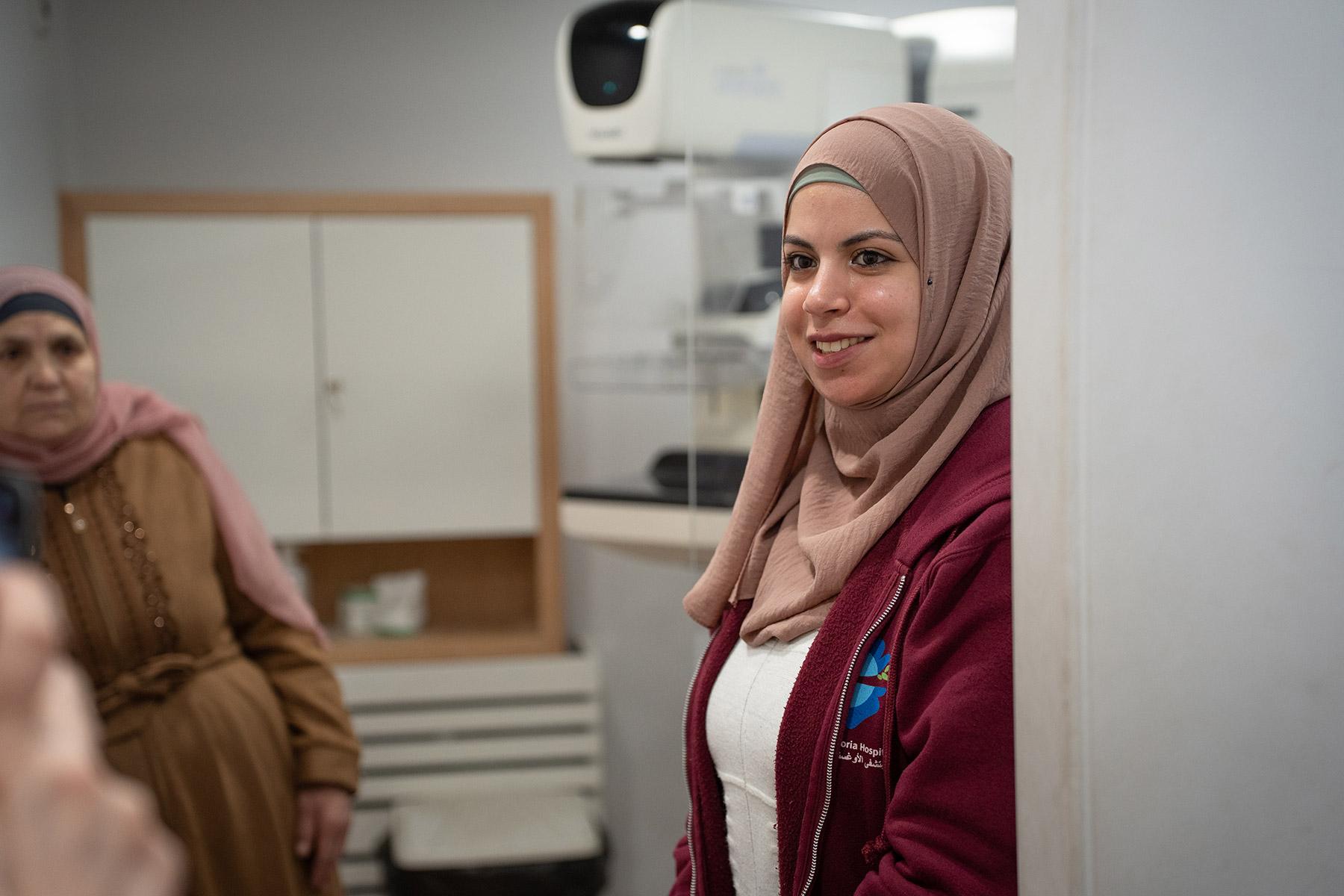Narmeen Awwad, radiation technician, during consultation at the "Pink Bus", a mobile mammography unit dispatched from the LWF Augusta Victoria-Hospital (AVH) in East Jerusalem. Photo: LWF/ Abdalla Elayyan