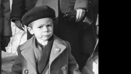 In the aftermath of the Second World War, the LWF supported thousands of displaced people in Europe. The young boy wearing an LWF pin on his coat lapel represents those pushed to leave their homes and find refuge elsewhere. Photo: LWF Archives