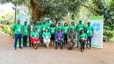 Participants of the Climate Justice Forum meeting in Tanzania, joined by ELCT Bishop Fredrik Shoo (center). Photo: ELCT