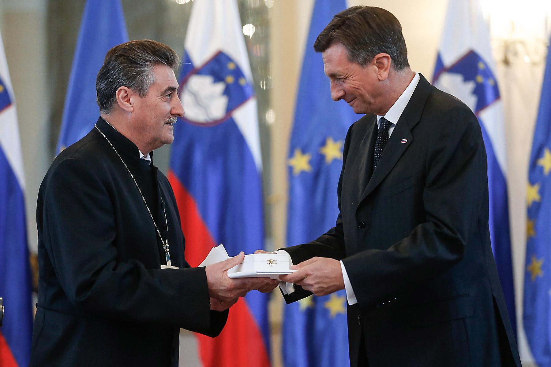 Republic of Slovenia President Borut Pahor awards Bishop ErniÅ¡a the Silver Order of Merit. Photo: Stanko Gruden/STA
