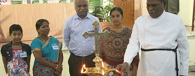 UELCI Executive Secretary Rev. Dr Augustine A. G. Jeyakumar (far right) lights a lamp to inaugurate the YMR 2013 conference in Chennai. Others joining in the symbolic action included (from left to right) Augustina Gerson, Ms Vasuki Jesudoss, Mr J. S. Anbu; and Annes Brida Rose. Â© UELCI