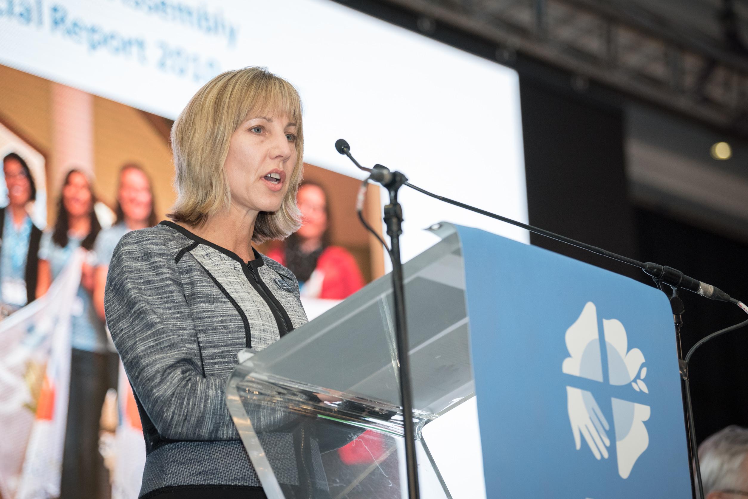 Christina Jackson-Skelton giving the report of the Finance Committee at the Lutheran World Federation's Twelfth Assembly. Photo: LWF/Albin Hillert