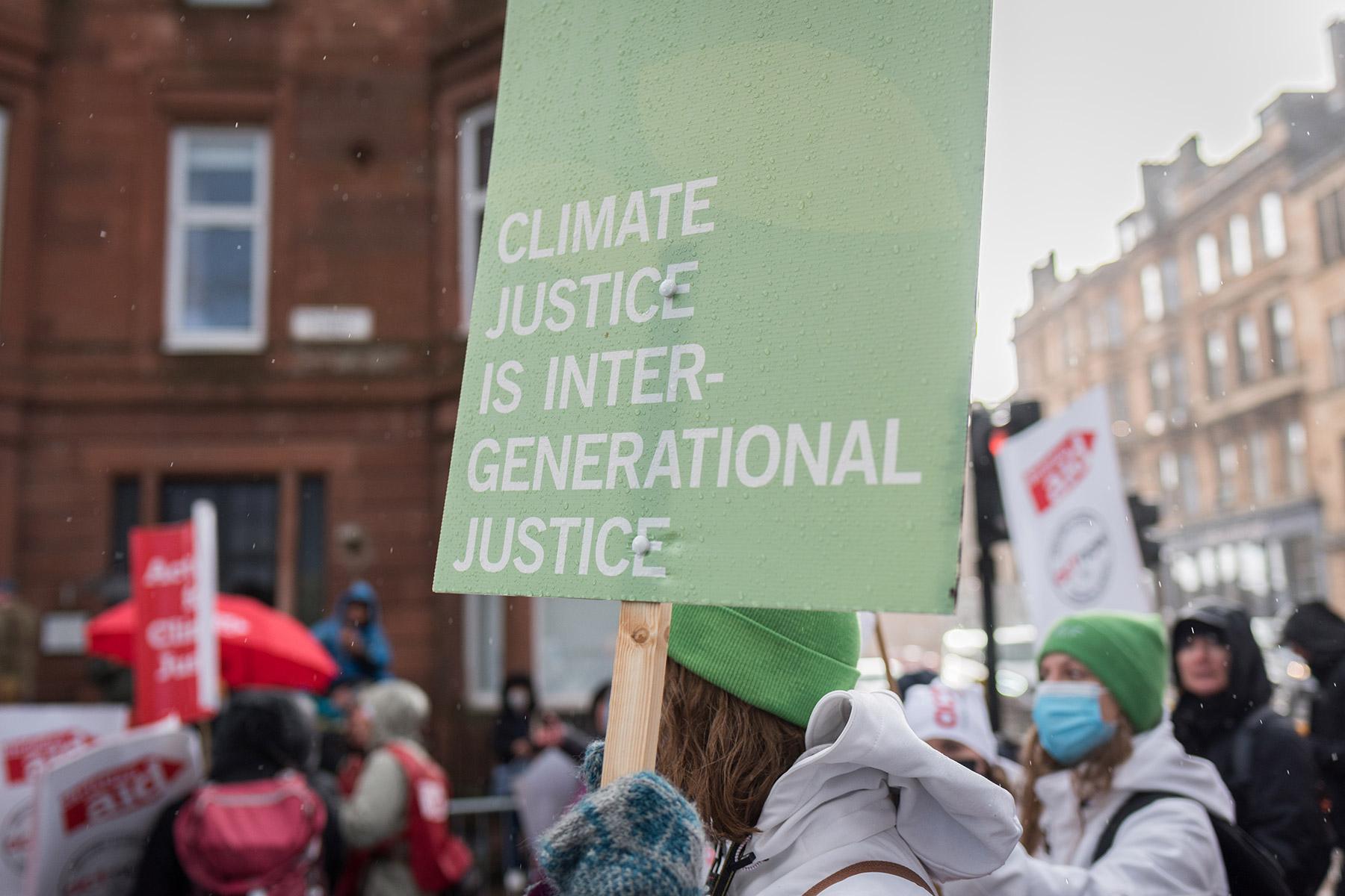 During the UN climate conference COP26, LWF delegates joined a climate march. One banner read âClimate justice is intergenerational justiceâ. Photo: LWF/Albin Hillert