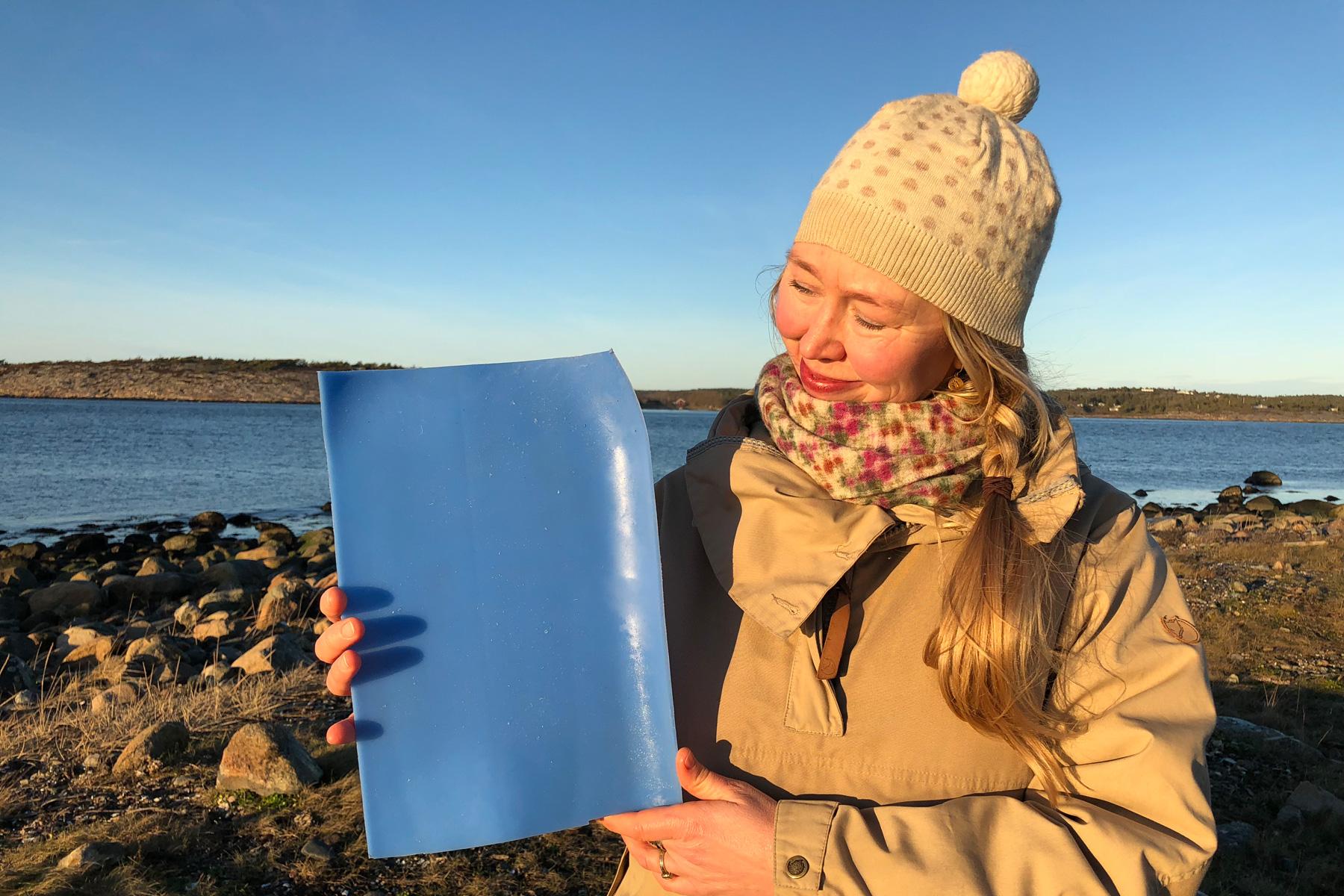 Solveig Egeland, an artist and cultural advisor to the Church of Norwayâs Diocese of Borg with a piece of plastic from the ocean. Photo: Mari Tefre