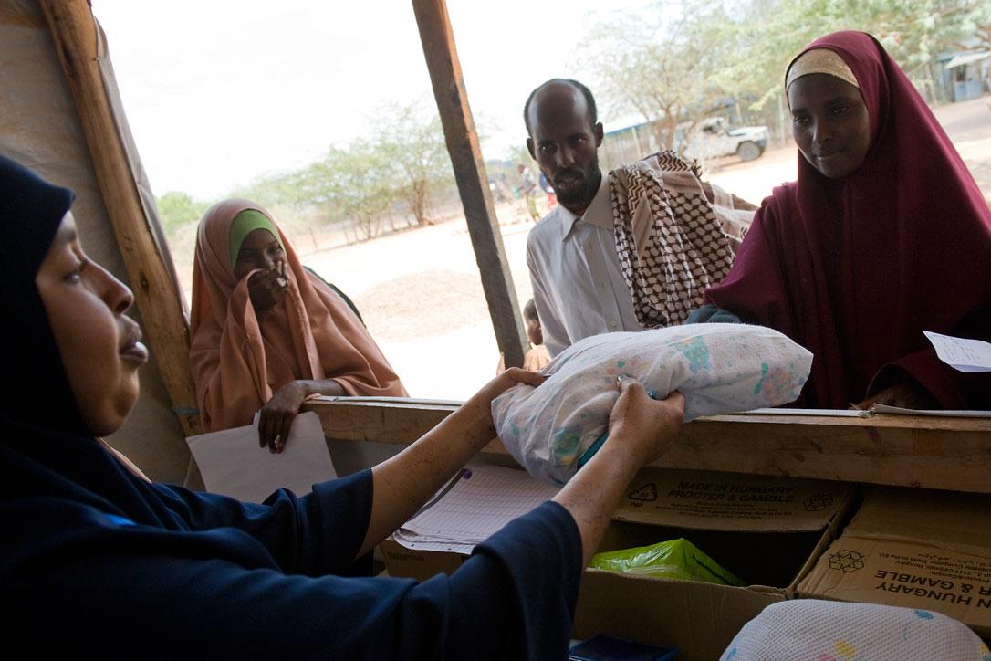 New arrivals at the Ifo refugee camp receive an LWR baby kit as well as other non-food items as they are formally registered during the reception process in Dadaab, Kenya. The Ifo settlement is the oldest of the camps in Dadaab, dating back to the early 1990s. Photo: Jonathan Ernst/LWR (2011)