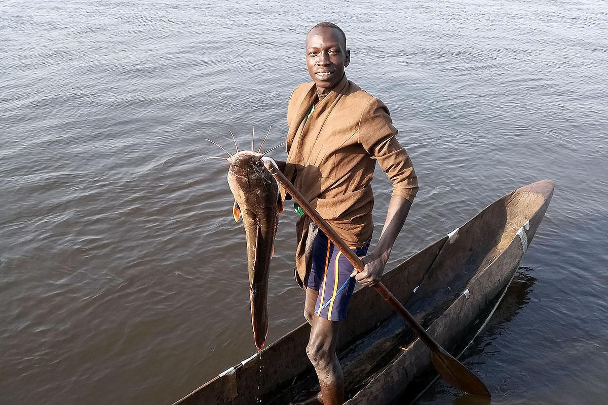 Fisherman Kur Kuany in his boat. Photo: LWF South Sudan