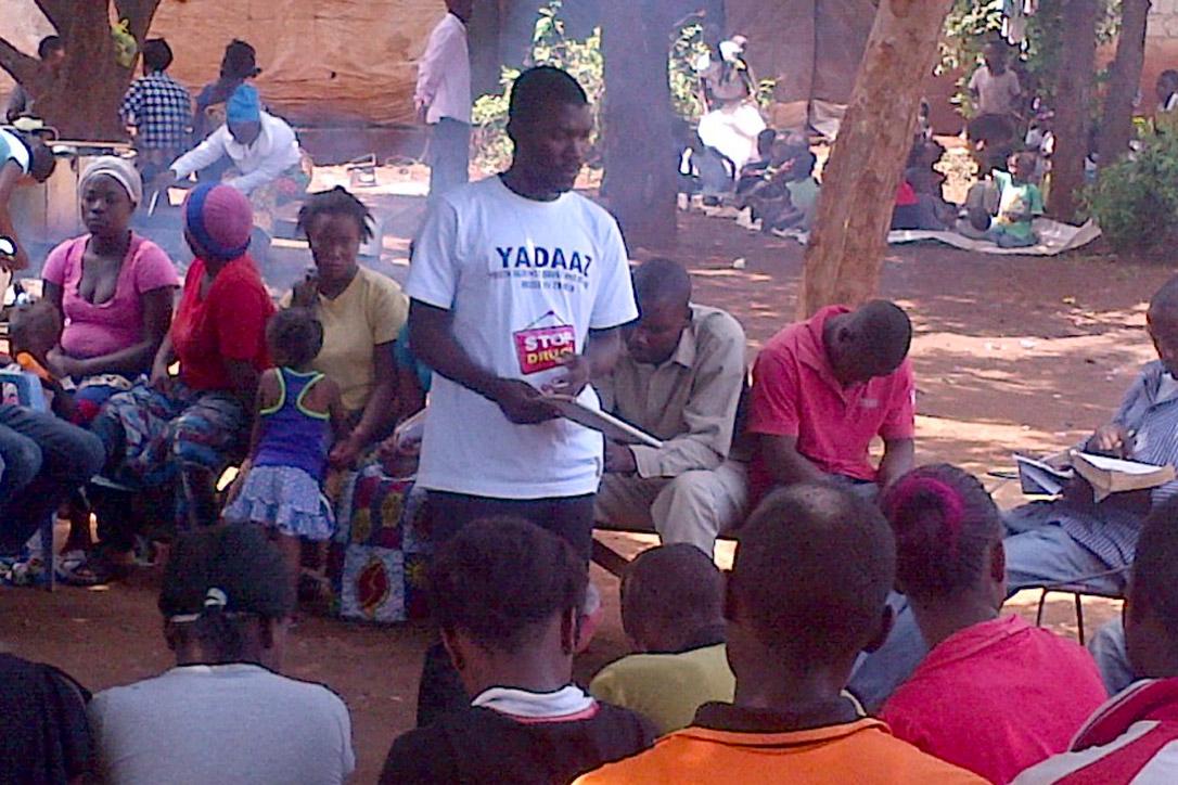 Kheke Chana warns residents of a Zambian village of the dangers of drug and alcohol abuse. Photo: ELKS