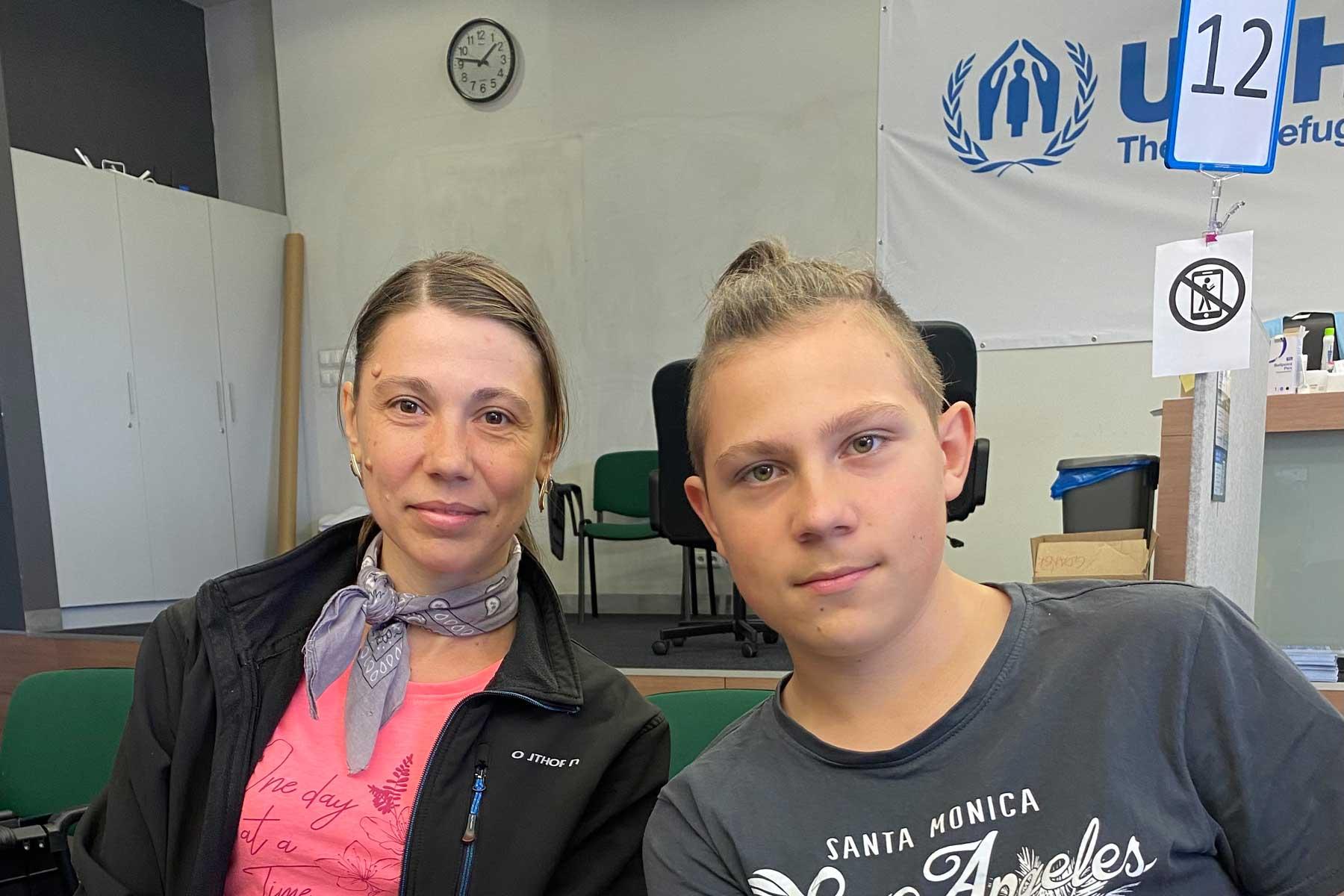 Dina with one of her sons. To support her children, she took a job below her qualifications. Photo: B. PACHUTA, LWF