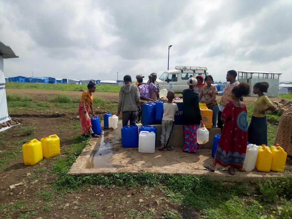 IDPs in Mekelle collecting water at a water point in Seba Kare IDP camp