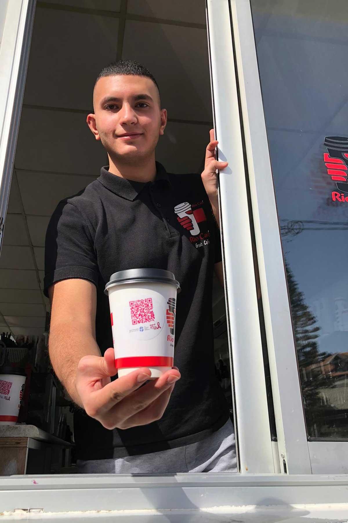 Rio Café, a popular coffee chain in Ramallah, is selling their brew in cups with a message on breast cancer this month. Photo: LWF/AVH