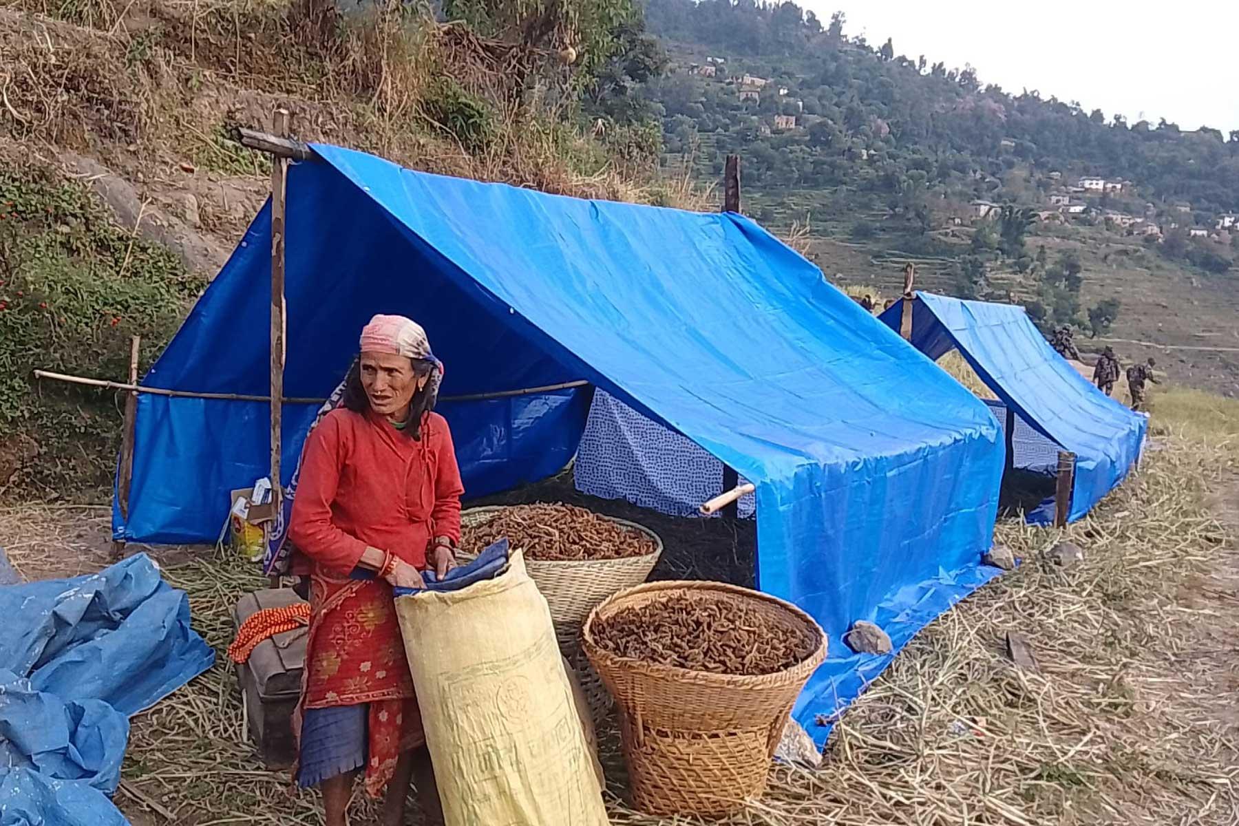 A woman with her makeshift tent in Purbichouki. Photo: Bhakta Raj Upadhyay/ USSBM Doti