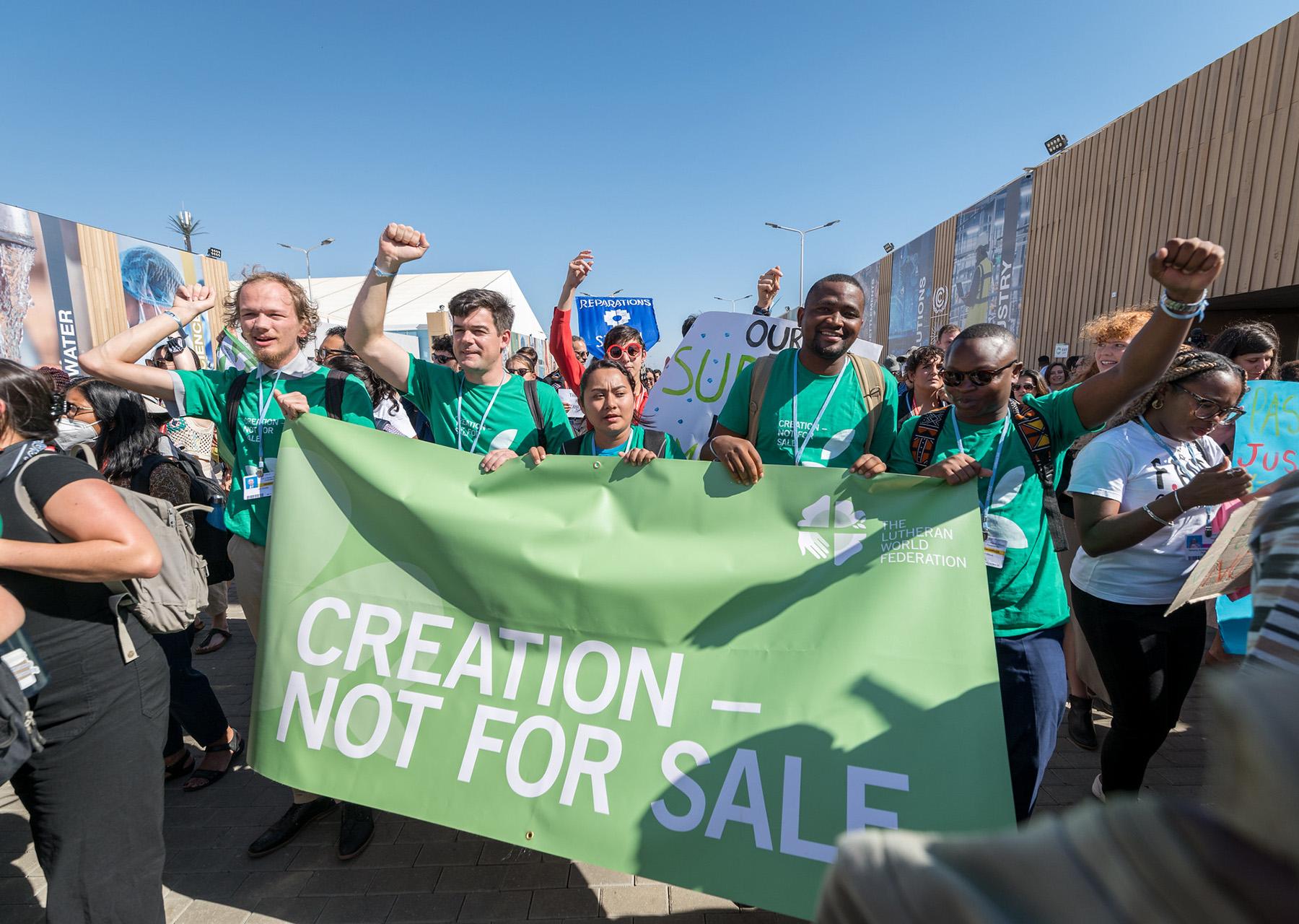The LWF delegation joins the march through the venue of the United Nations climate change conference COP27 in Sharm el-Sheikh, Egypt, calling for climate justice and urgent action. Photo credit: LWF/Albin Hillert