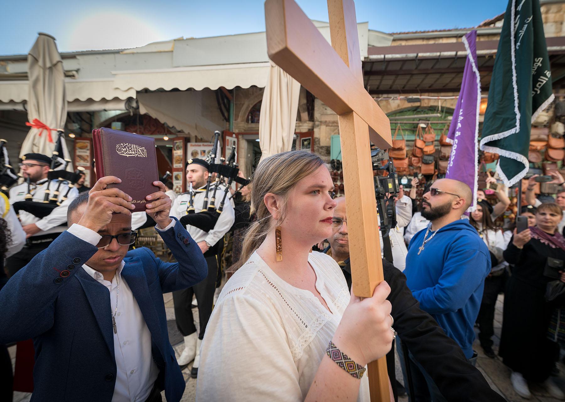 A woman leads the procession into the Lutheran Church of the Redeemer, Jerusalem, for the ordination service for Sally Azar of the Evangelical Lutheran Church in Jordan and the Holy Land, on 22 January 2023. The LWF voiced deep concern about the siituations of Christians in the Holy Land. Photo: LWF/Albin Hillert
