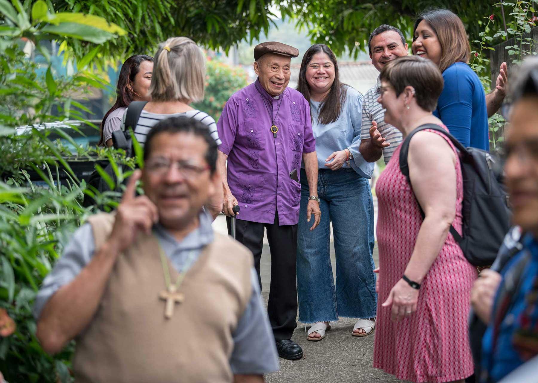 24 October 2023, San Salvador, El Salvador: Bishop Medardo Gómez of the Salvadoran Lutheran Church (centre) pictured welcoming visitors to the synod of his church in San Salvador. Photo: LWF/A. Hillert