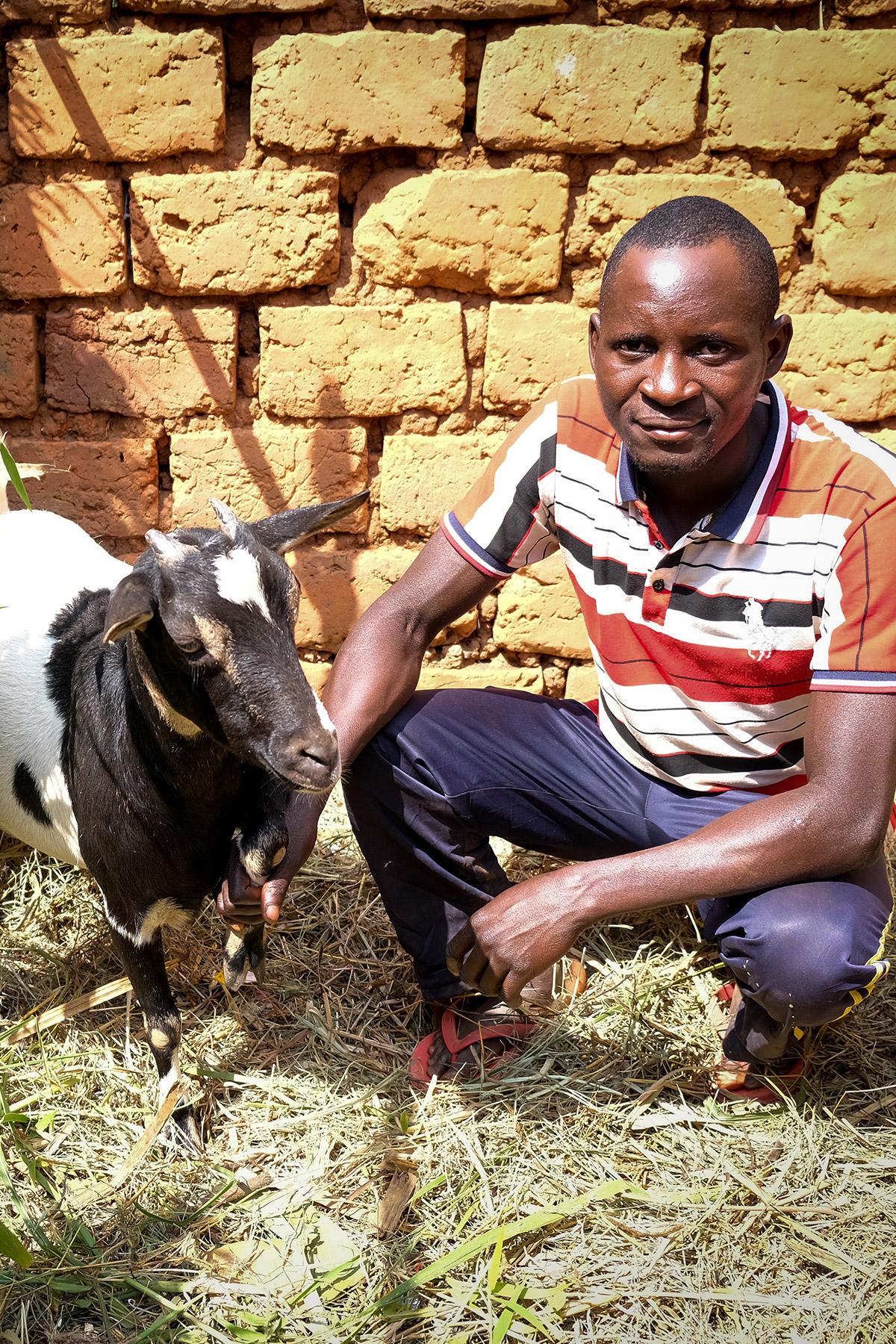 Musa Ntakarutimana and his goat. Photo: LWF/ L. Gillabert