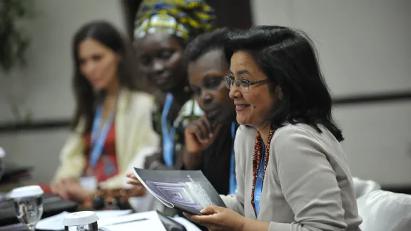 Elisabeth Arciniegas, of the LWF Committee for World Service enjoys a moment of fun during the 2014 pre-council youth and women meeting. Photo: LWF/M. Renaux