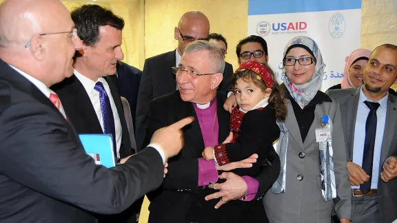 The ribbon cutting ceremony, led by Bishop Munib A. Younan, holding a child who may be undergoing a bone marrow transplantation in the newly opened Bone Marrow Transplant Unit. Photo: LWF Jerusalem