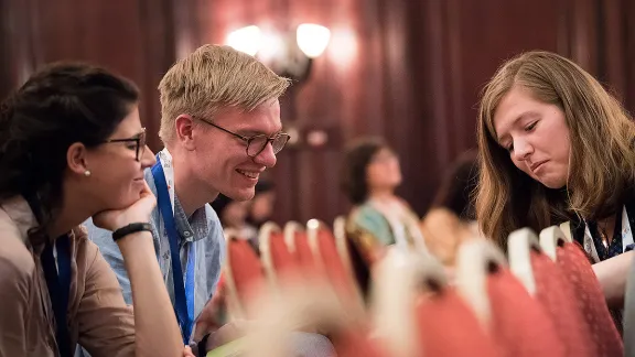 Paula GÃ¶hre (left) and Tim Sonnemeyer of the Evangelical Lutheran Church in Bavaria welcome their synod's decision to strengthen youth participation. Here they meet with Rebecca LÃ¼hmann of the Evangelical Lutheran Church of Hanover at the LWF Twelfth Assembly. Photo: LWF/Albin Hillert