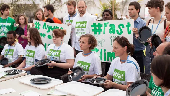 Fasting action at COP20. Photo: LWF/Sean Hawkey