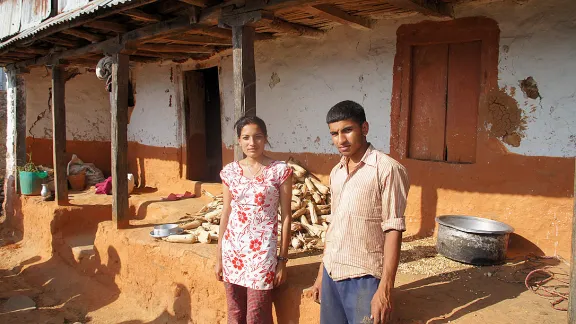 Laxmi and Laxman in front of their house. The outer walls of the house bear cracks. Inside, everything has collapsed. Photo: LWF/ C. KÃ¤stner