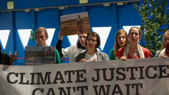 Young people urging for climate action during COP25 in Madrid, Spain. Photo: LWF/Albin Hillert