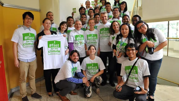 LWF President, Bishop Munib Younan, General Secretary, Rev. Dr Martin Junge and young council members advocate for climate justice. Photo: LWF/Sean Hawkey 