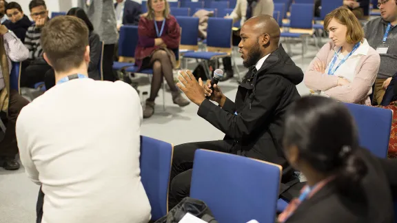 LWF COP 24 delegate, Mr Khulekani Magwazah, Evangelical Lutheran Church in Southern Africa, speaks at one of the conference events in Katowice, Poland. Photo: LWF/Sean Hawkey