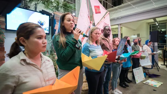 LWF youth delegate Nora Antonsen from the Church of Norway (second from left) speaks, as in Saint George's Tron church in Glasgow, representatives of a variety of faiths gather to hand in a shared petition to COP26. They call world leaders to take urgent action for climate justice. Photo: LWF/Albin Hillert