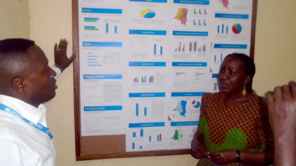 Patrick Matala head of Unicef Kananga explaining access to basic services to Anne Wangari from LWF. Photo: LWF/DRC