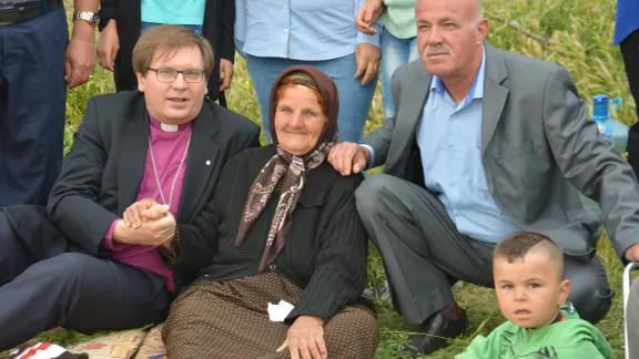 Bishop Dr Tamas Fabiny, Northern Diocese of the Evangelical Lutheran Church in Hungary sits with displaced people in northern Iraq. Photo: ELCH Northern Diocese