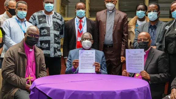 The Ethiopian Evangelical Church Mekane Yesus (EECMY) President Yonas Dibisa (seated right) and the Evangelical Lutheran Church in Tanzania Presiding Bishop Dr. Fredrick Shoo (center) signed a âLearning and Sharingâ collaboration agreement in July.  LWF President Archbishop Dr Panti Filibus Musa is seated left.Photo: E.Adolph/ELCT