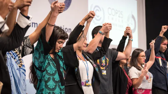 People of faith standing together for climate justice during COP25 in Madrid, Spain. Photo: LWF/Albin Hillert