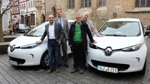 Participating in the e-mobility pilot project, from left: Jan Westphal (director, Horizonte gGmbH Altenburg), Dietmar Wiegand (deputy head, Altenburger Land church district), Rev. Christian Sparsbrod ( Rudolstadt-Saalfeld church district) and Rev. Jens Bechtloff ( KindelbrÃ¼ck pastorate) with the new cars. Photo: EKM/Diana Steinbauer