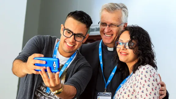 LWF General Secretary Rev. Dr Martin with LWF Youth Pre-Assembly delegates, Grosvyn Ariel RodrÃ­guez RamÃ­rez (Honduras), left, and Karla Steilmann (Argentina) in Ondangwa, Namibia. Photo: LWF/JC Valeriano