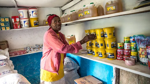 A woman in the community store in Despagne. Photo: LWF Haiti/H. Enge