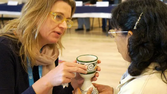 IELCH Bishop Izani Bruch (left) sharing Holy Communion with Peruvian pastor Rev. Ofelia DÃ¡vila during the 2015 Latin American and Caribbean Leadership Conference in La Paz, Bolivia. Photo: Eugenio Albrecht