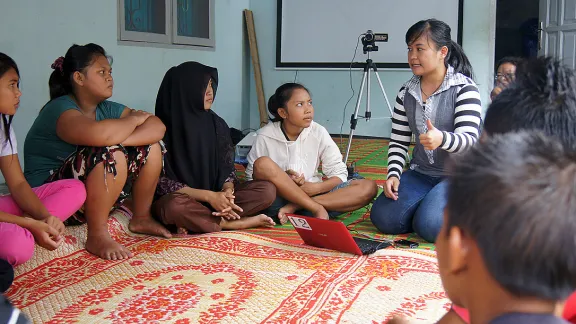 Elisabeth Purba (center) talking about HIV and AIDS at a youth workshop organized by the Indonesia LWF National Committee in Desa Bulu Cina, Sumatra. New global development goals will work to lower HIV and AIDS transmission rates. Photo: LWF/C. KÃ¤stner