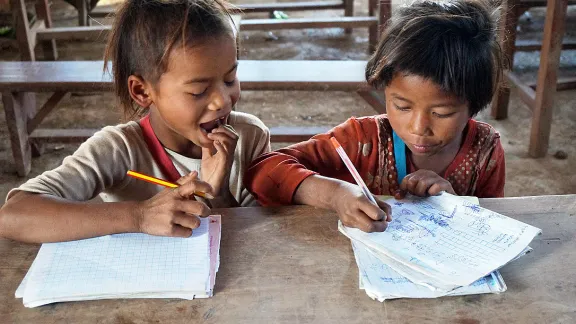 Caption: Vone and Viengkeo are eager students at the local school. Photo: LWF Laos