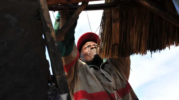 A refugee builds a traditional house in Moyo, northern Uganda. The country has been commended for its progressive refugee policy, allowing displaced people to settle and start a livelihood. Photo: LWF/ C. KÃ¤stner