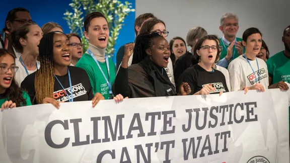 Young climate activists gathered in December 2019 at the COP25 summit in Madrid, Spain sound the alarm for climate justice. Photo: LWF/Albin Hillert