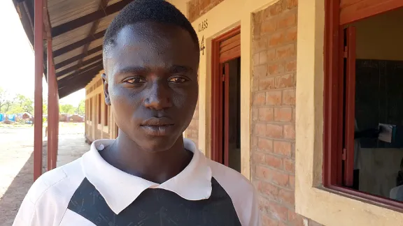 Walid Awad Majir outside a classroom in Ajoung Thok refugee camp, Unity State, South Sudan. Photo: LWF South Sudan/Birhanu Waka