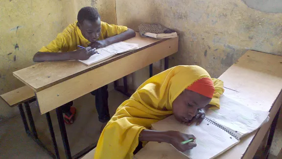 Hussein (left) and his sister Nadhifo, the two siblings of the Ali family in class at Hagadera refugee camp, Dadaab Kenya. Photo: LWF Kenya â Dadaab