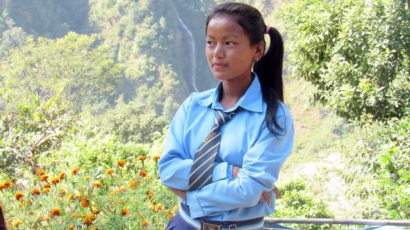 Sanu in her school uniform. The prospect of higher education prompted her to find a way of attending school, even though school is a day's walk from home. Photo: Umesh Pokharel/LWF Nepal