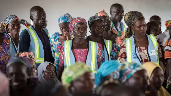 Refugees wait their turn, at a distribution of non-food items in Minawao. The Minawao camp for Nigerian refugees, located in the Far North region of Cameroon, hosts some 58,000 refugees from North East Nigeria. The refugees are supported by the Lutheran World Federation, together with a range of partners. Photo: LWF/Albin Hillert