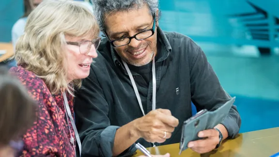 Participants, Lilian Beck from the United Evangelical Lutheran Church (Argentina) and Julio Melara from the Lutheran Costa Rican Church (Costa Rica), in a discussion during the workshop launching the âWaking the Giantâ initiative in BogotÃ¡. Photos: LWF/Albin Hillert