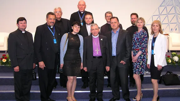 LWF President Bishop Dr Munib A. Younan with Bishop Yuri Novgorodov (very last row) and other pastors and church officials of the Evangelical Lutheran Church in the Republic of Kazakhstan, during the June visit to Astana. Photo: ELCRK