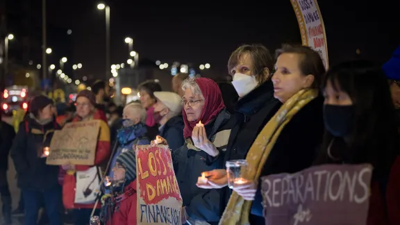 People of different faith traditions gather for a silent vigil in Glasgow, during the COP26 summit, to remember all those suffering from the impact of climate change. Photo: LWF/A. Hillert