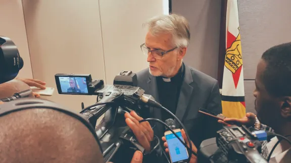 Journalists interview LWF General Secretary Martin Junge following a meeting with government officials in Harare. Photo: LWF/A. Danielsson