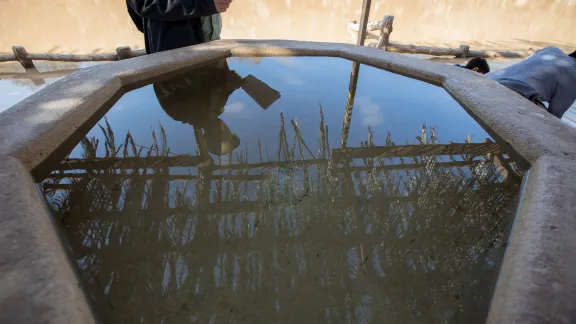 A baptismal font at the edge of the River Jordan