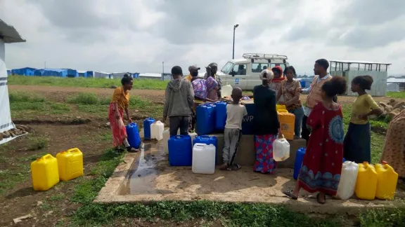 IDPs in Mekelle collecting water at a water point in Seba Kare IDP camp